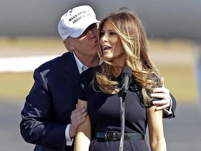 Republican presidential candidate Donald Trump kisses his wife Melania as she introduces him at a campaign rally Saturday, Nov. 5, 2016, in Wilmingto