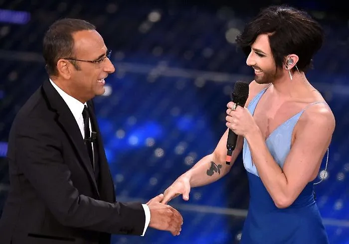 Una parolaccia scuote il Festival tra Charlize Theron e Conchita Wurst